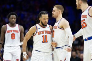 New York Knicks guard Jalen Brunson (11) reacts with guard Donte DiVincenzo (0) after scoring against the Philadelphia 76ers during the second half of game six of the first round for the 2024 NBA playoffs at Wells Fargo Center.