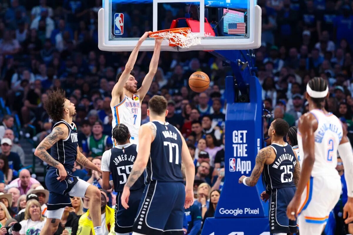 May 11, 2024; Dallas, Texas, USA; Oklahoma City Thunder forward Chet Holmgren (7) dunks over Dallas Mavericks forward Derrick Jones Jr. (55) during the first half during game three of the second round for the 2024 NBA playoffs at American Airlines Center. Mandatory Credit: Kevin Jairaj-USA TODAY Sports