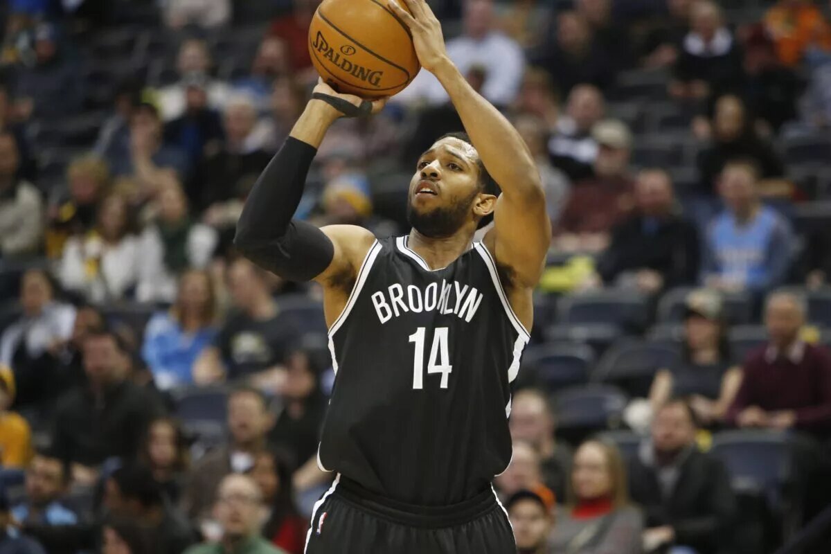 Feb 23, 2015; Denver, CO, USA; Brooklyn Nets guard Darius Morris (14) shoots the ball during the first half against the Denver Nuggets at Pepsi Center. Mandatory Credit: Chris Humphreys-USA TODAY Sports