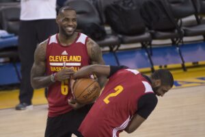 Former Cleveland Cavaliers teammates LeBron James and Kyrie Irving share a laugh