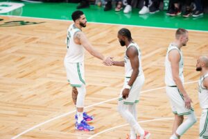 Boston Celtics players Jaylen Brown and Jayson Tatum shake hands