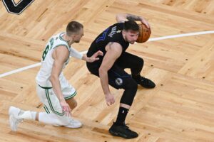 Kristaps Porzingis (Boston Celtics) guards Luka Doncic (Dallas Mavericks) in the 2024 NBA Finals