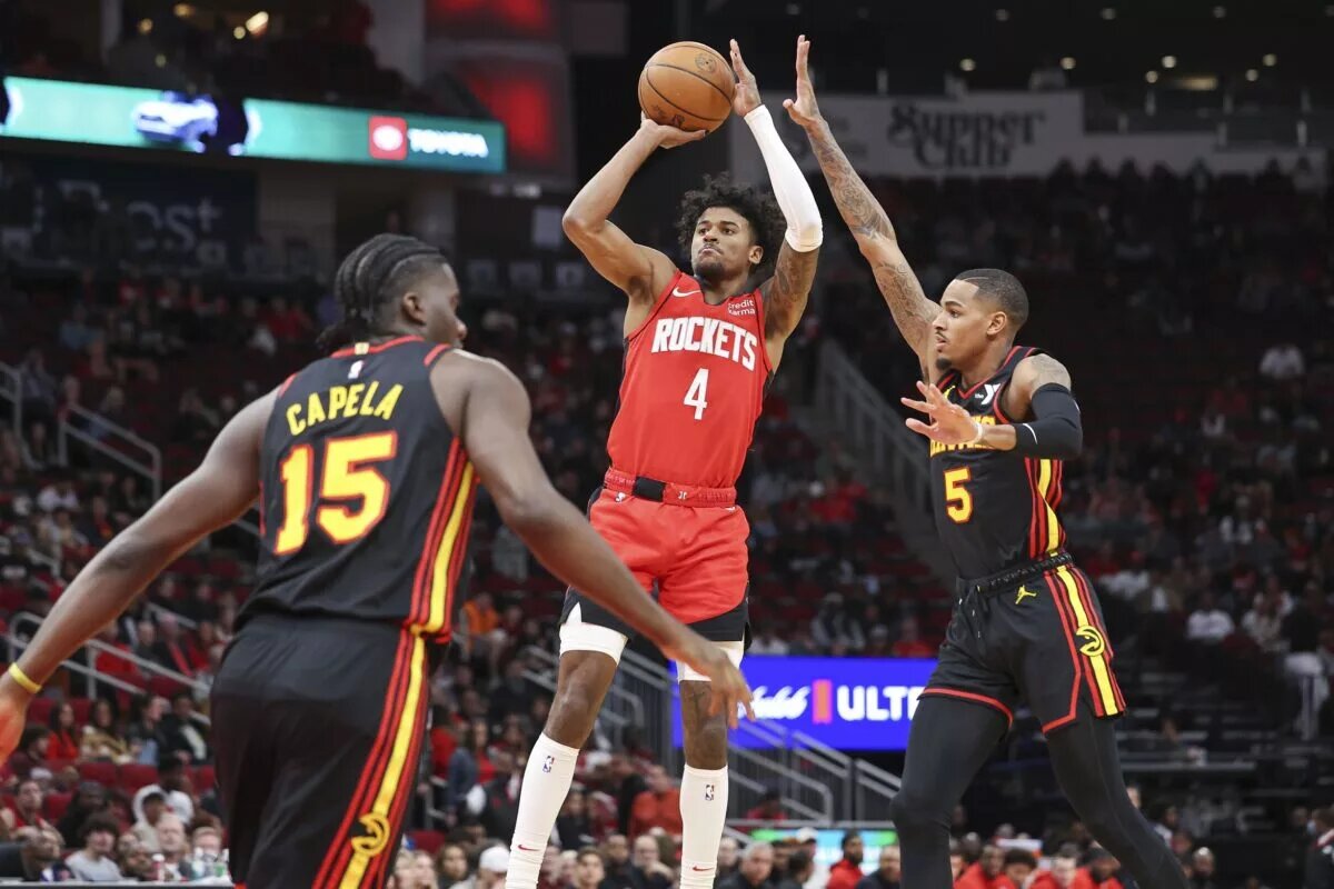 Atlanta Hawks guard Dejounte Murray contests shot by Houston Rockets wing Jalen Green