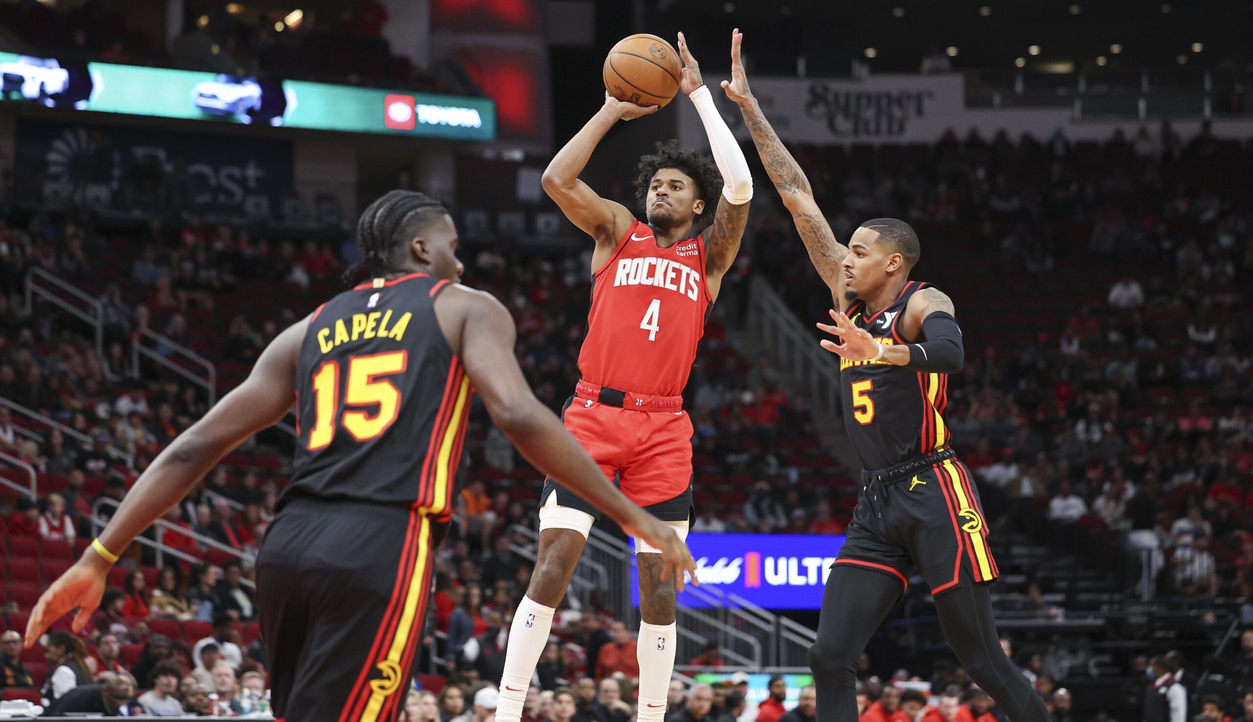 Atlanta Hawks guard Dejounte Murray contests shot by Houston Rockets wing Jalen Green