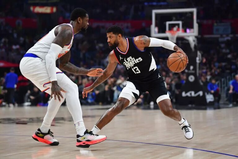 Los Angeles Clippers star Paul George sizes up New York Knicks forward Julius Randle