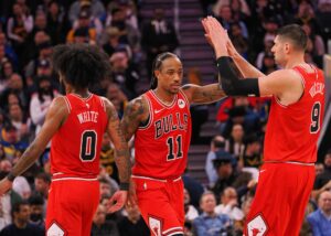 Coby White, DeMar DeRozan, and Nikola Vucevic of the Chicago Bulls