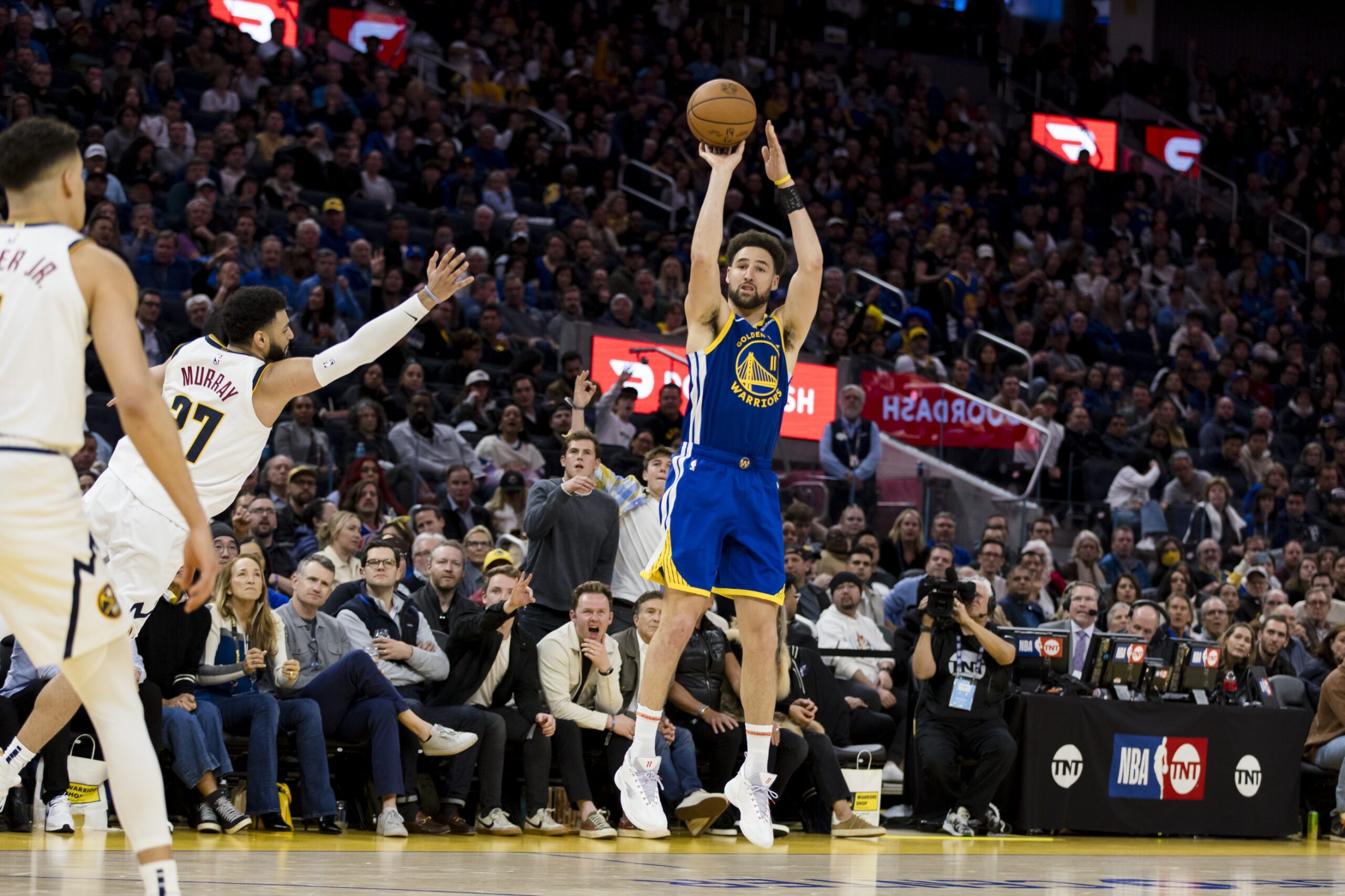 Golden State Warriors wing Klay Thompson shoots against Denver Nuggets defense
