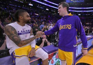 May 12, 2023; Los Angeles, California, USA; Los Angeles Lakers guard D'Angelo Russell (1) and guard Austin Reaves (15) celebrate after winning game six of the 2023 NBA playoffs against the Golden State Warriors at Crypto.com Arena. Mandatory Credit: Jayne Kamin-Oncea-USA TODAY Sports