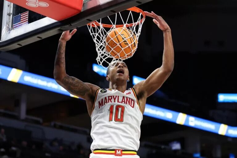 Mar 13, 2024; Minneapolis, MN, USA; Maryland Terrapins forward Julian Reese (10) dunks against the Rutgers Scarlet Knights during the second half at Target Center. Mandatory Credit: Matt Krohn-USA TODAY Sports