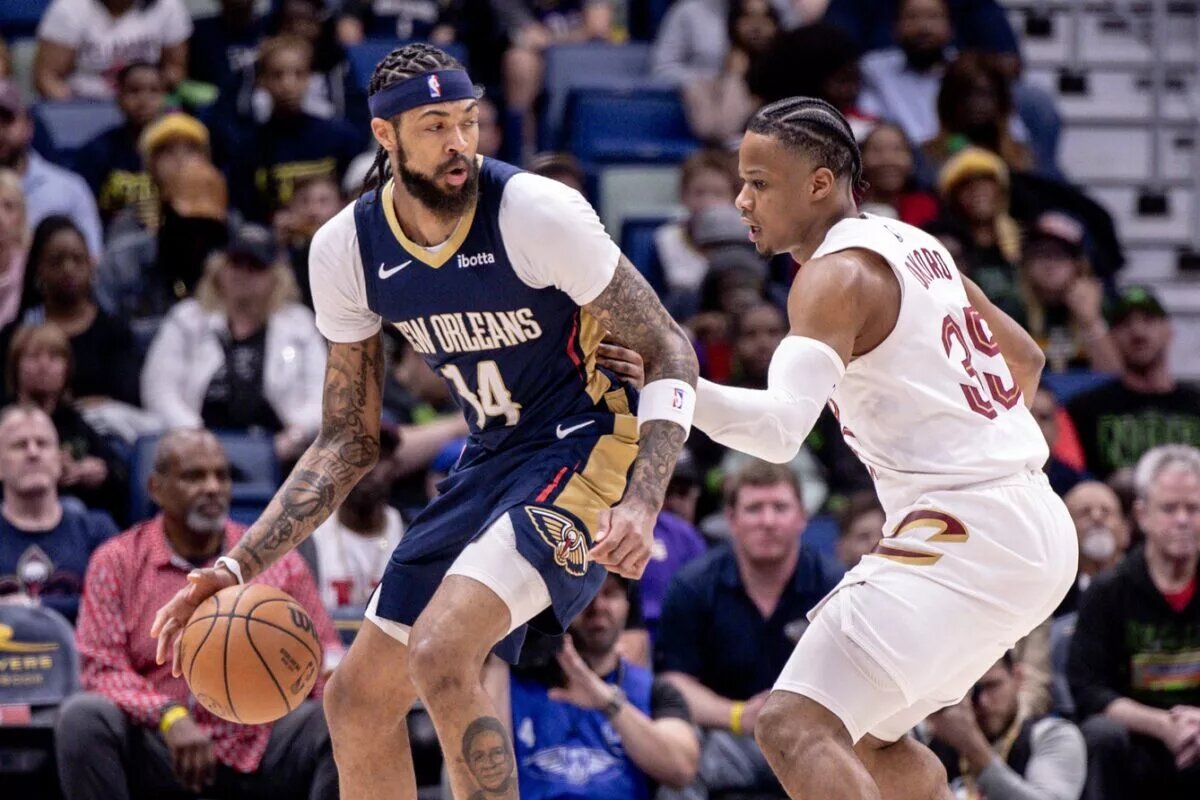 New Orleans Pelicans forward Brandon Ingram guarded by Cleveland Cavaliers swingman Isaac Okoro