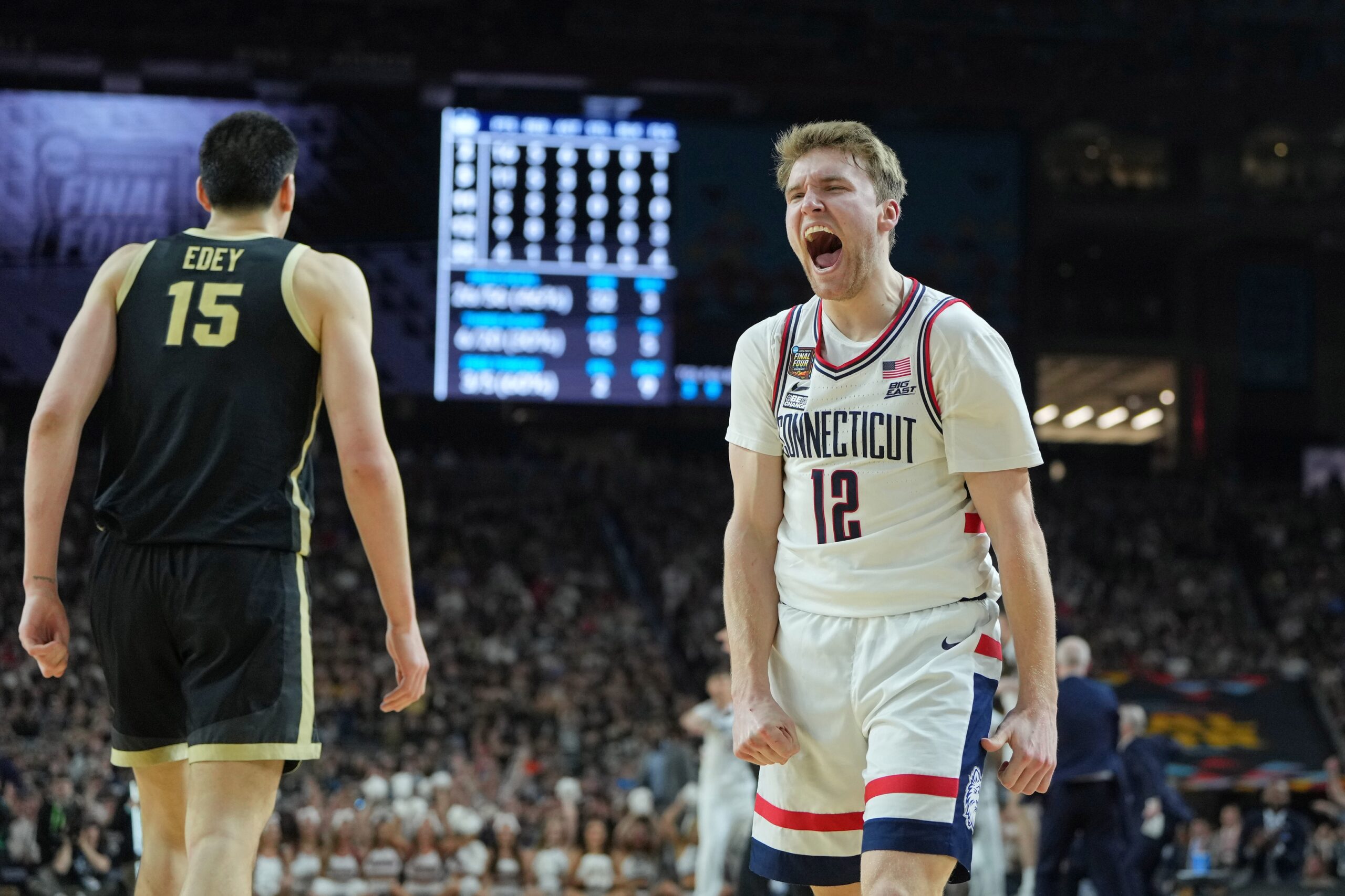 Apr 8, 2024; Glendale, AZ, USA; Connecticut Huskies guard Cam Spencer (12) reacts after a play against the Purdue Boilermakers during the second half of the national championship game of the Final Four of the 2024 NCAA Tournament at State Farm Stadium. Mandatory Credit: Bob Donnan-USA TODAY Sports