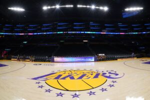 Apr 9, 2024; Los Angeles, California, USA; THe Los Angeles Lakers logo at midcourt Crypto.com Arena. Mandatory Credit: Kirby Lee-USA TODAY Sports