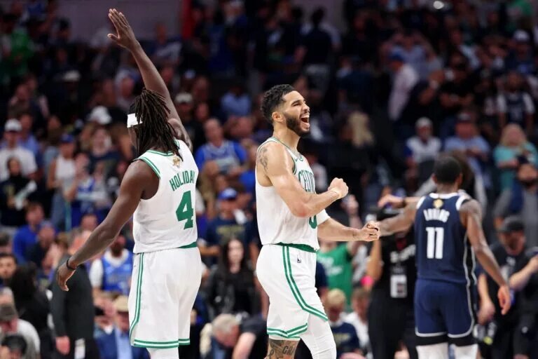 Jun 12, 2024; Dallas, Texas, USA; Boston Celtics guard Jrue Holiday (4) and forward Jayson Tatum (0) celebrates after their win against the Dallas Mavericks in game three of the 2024 NBA Finals at American Airlines Center. Mandatory Credit: Kevin Jairaj-USA TODAY Sports