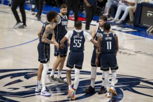 Jun 14, 2024; Dallas, Texas, USA; Dallas Mavericks center Dereck Lively II (2) and forward Maxi Kleber (42) and forward Derrick Jones Jr. (55) and guard Luka Doncic (77) and guard Kyrie Irving (11) celebrate during the game between the Dallas Mavericks and the Boston Celtics in game four of the 2024 NBA Finals at American Airlines Center. Mandatory Credit: Jerome Miron-USA TODAY Sports