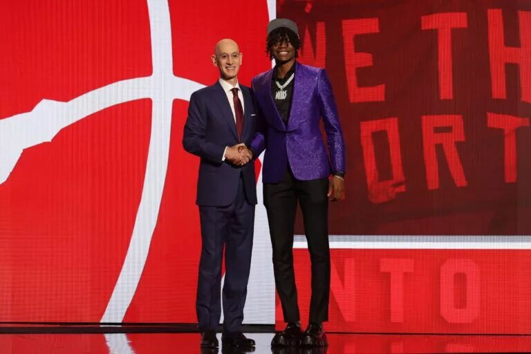 a'Kobe Walter poses for photos with NBA commissioner Adam Silver after being selected in the first round by the Toronto Raptors in the 2024 NBA Draft at Barclays Center.