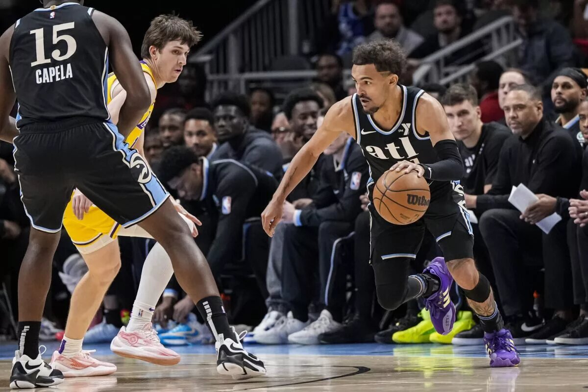 Atlanta Hawks guard Trae Young (11) dribbles against the Los Angeles Lakers