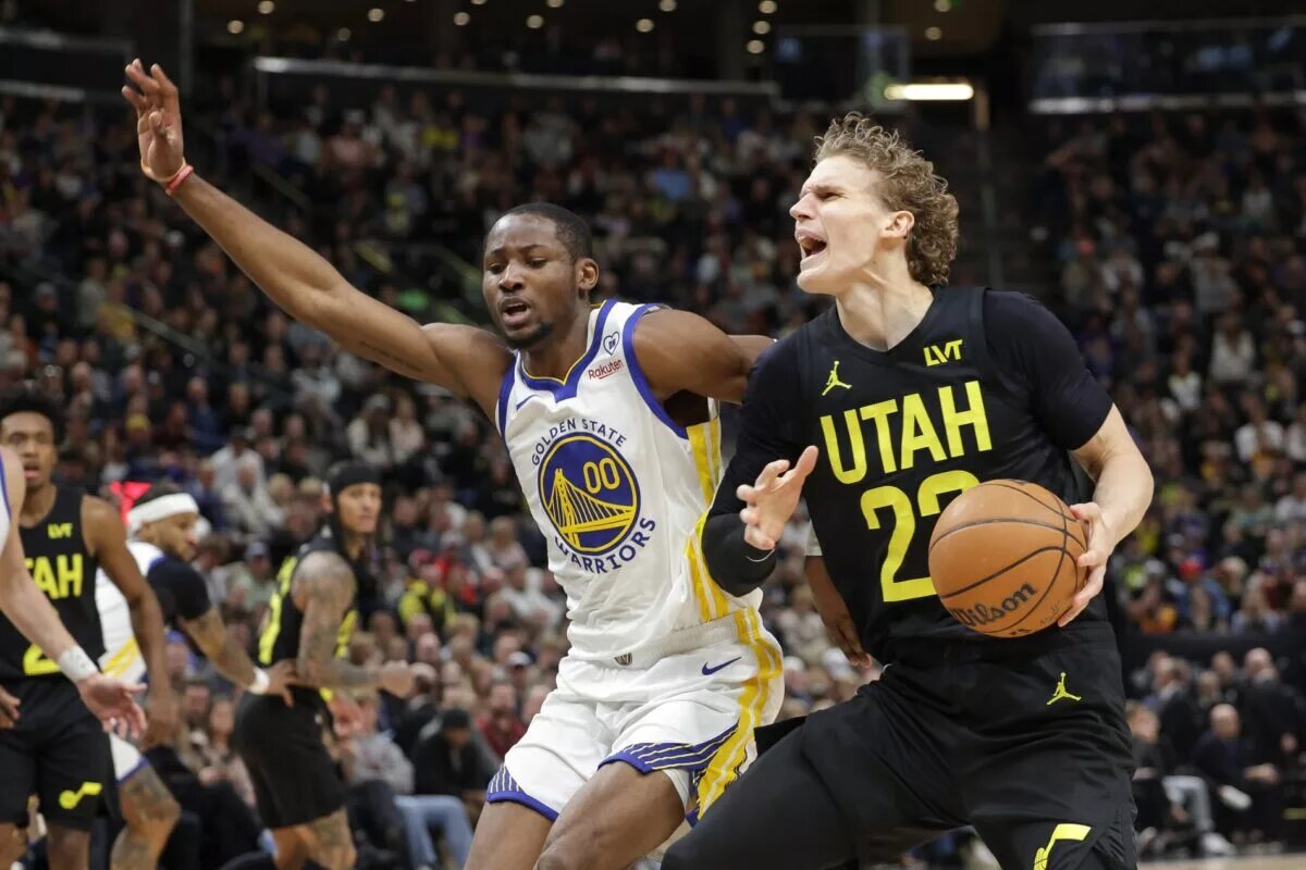 Utah Jazz forward Lauri Markkanen (23) is fouled by Golden State Warriors forward Jonathan Kuminga (00)