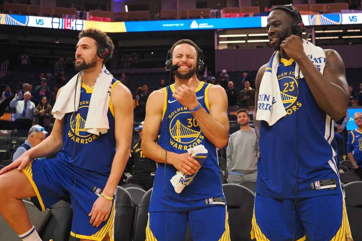 Golden State Warriors guard Klay Thompson (11), guard Stephen Curry (30) and forward Draymond Green (23)