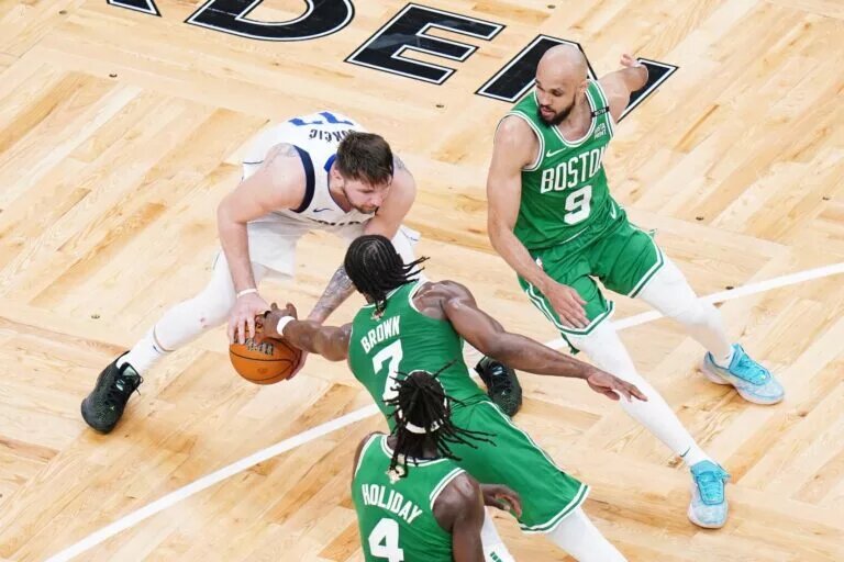 Boston Celtics guards Jaylen Brown, Jrue Holiday, and Derrick White before Paris Olympics