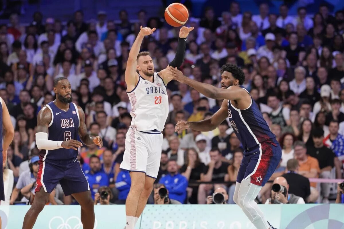 Team USA center Joel Embiid guards Serbia guard Marko Guduric during Paris Olympics
