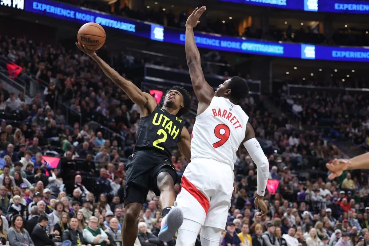 Utah Jazz guard Collin Sexton (2) goes to the basket against Toronto Raptors guard RJ Barrett (9)
