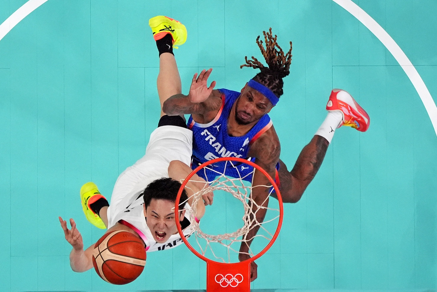 Japan point guard Yuki Kawamura (5) shoots the ball against France point guard Andrew Albicy (6) in men‚Äôs basketball group B play during the Paris 2024 Olympic Summer Games