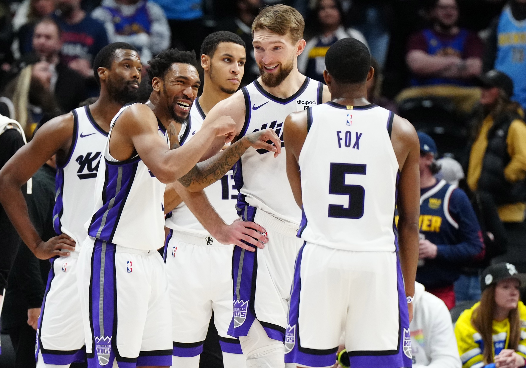 Sacramento Kings players huddle up, including Keegan Murray