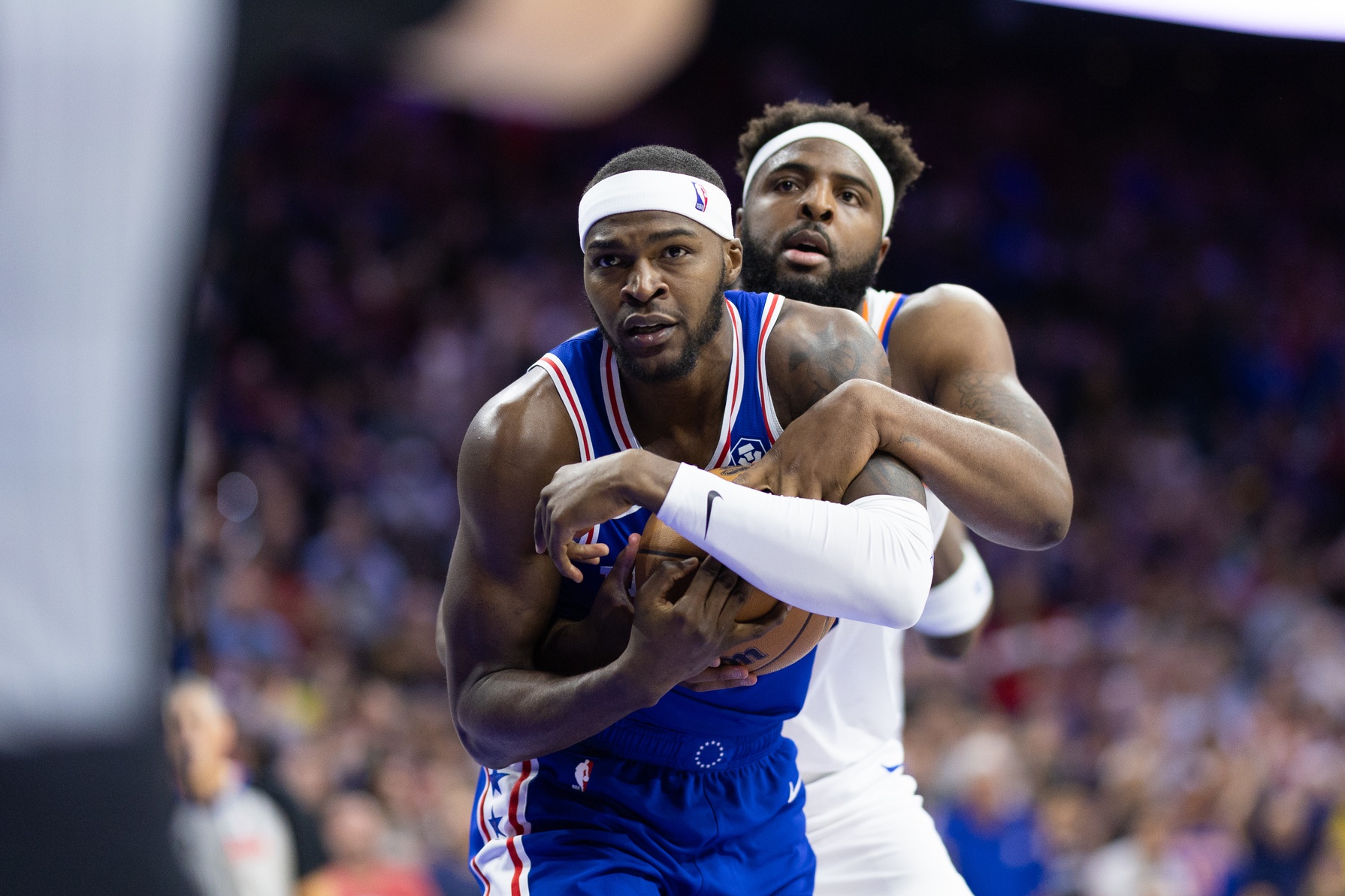 New York Knicks center Mitchell Robinson and Detroit Pistons center Paul Reed