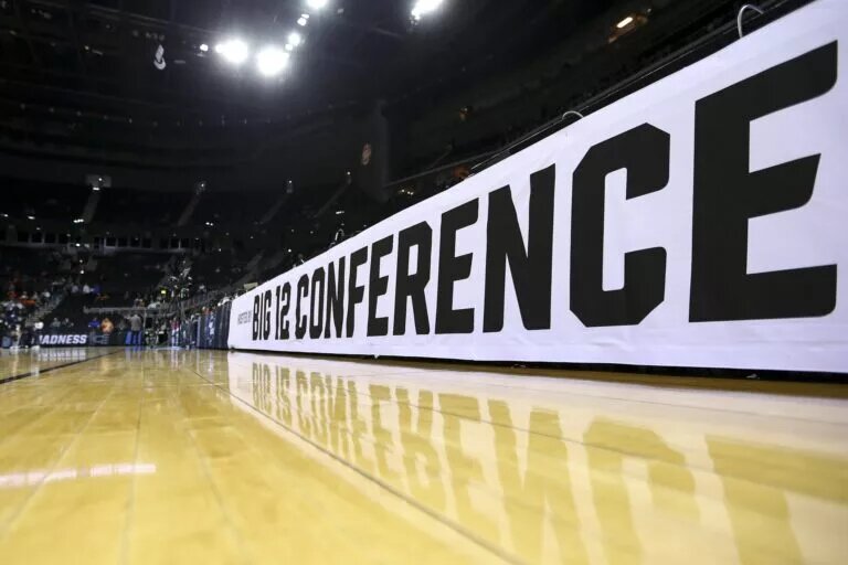 Mar 26, 2023; Kansas City, MO, USA; The BIG12 logo is seen on the court prior to the game between the Miami Hurricanes and the Texas Longhorns at the T-Mobile Center. Mandatory Credit: William Purnell-USA TODAY Sports