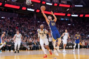 Apr 2, 2024; San Francisco, California, USA; Golden State Warriors guard Klay Thompson (11) shoots the ball in front of Dallas Mavericks center Daniel Gafford (21) in the third quarter at the Chase Center. Mandatory Credit: Cary Edmondson-USA TODAY Sports