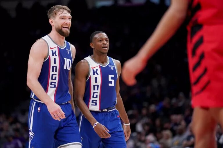 Sacramento Kings forward Domantas Sabonis (10) and guard De'Aaron Fox (5) walk on the court during a break in the action against the Portland Trail Blazers in the third quarter at the Golden 1 Center.