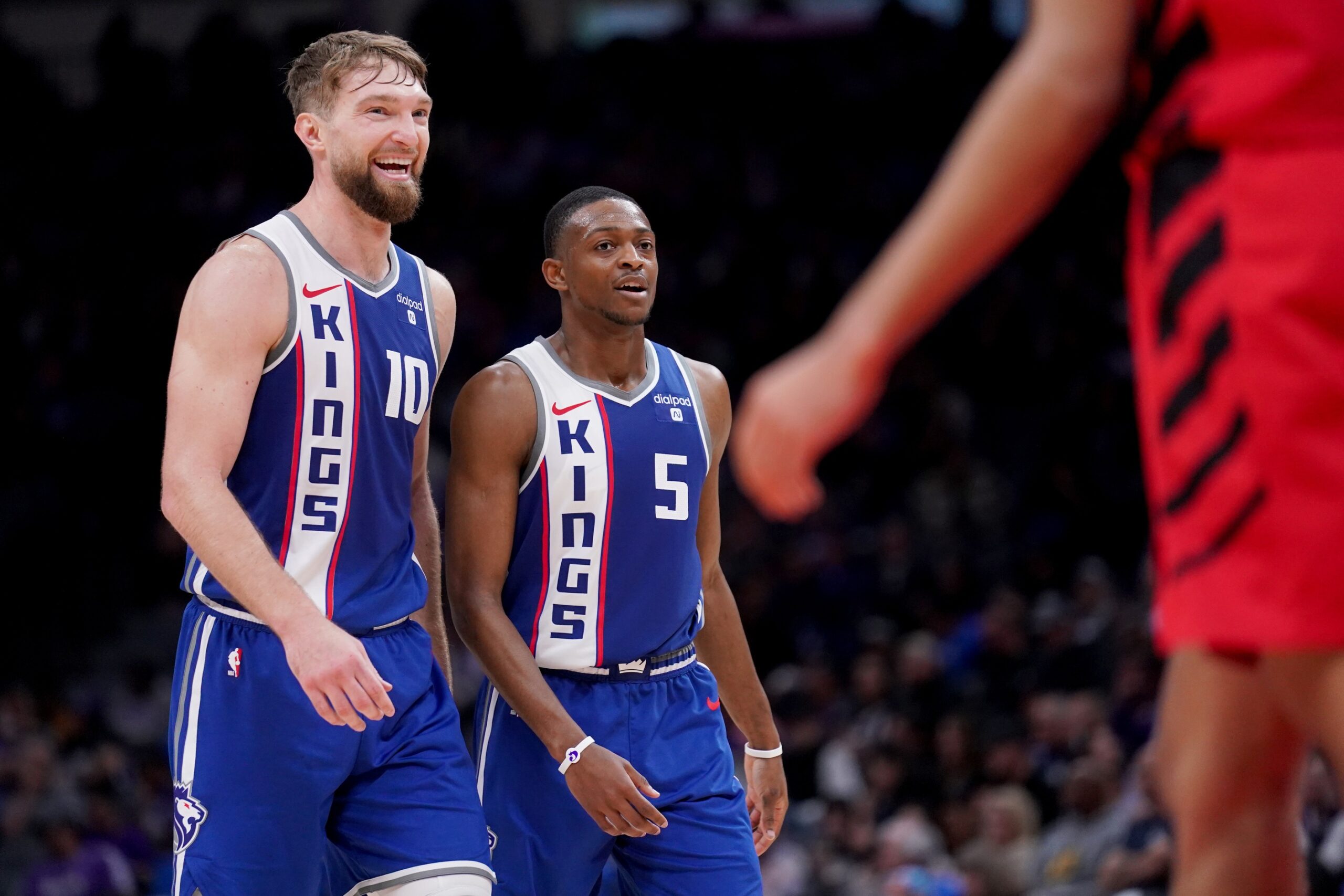 Sacramento Kings forward Domantas Sabonis (10) and guard De'Aaron Fox (5) walk on the court during a break in the action against the Portland Trail Blazers in the third quarter at the Golden 1 Center.