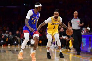 Apr 25, 2024; Los Angeles, California, USA; Los Angeles Lakers guard D'Angelo Russell (1) moves the ball against Denver Nuggets guard Kentavious Caldwell-Pope (5) during the second half in game three of the first round for the 2024 NBA playoffs at Crypto.com Arena. Mandatory Credit: Gary A. Vasquez-USA TODAY Sports