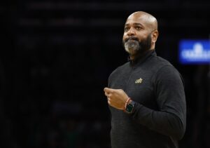Cleveland Cavaliers head coach J.B. Bickerstaff checks the scoreboard during a timeout in the second quarter of game one of the second round of the 2024 NBA playoffs against the Boston Celtics at TD Garden.