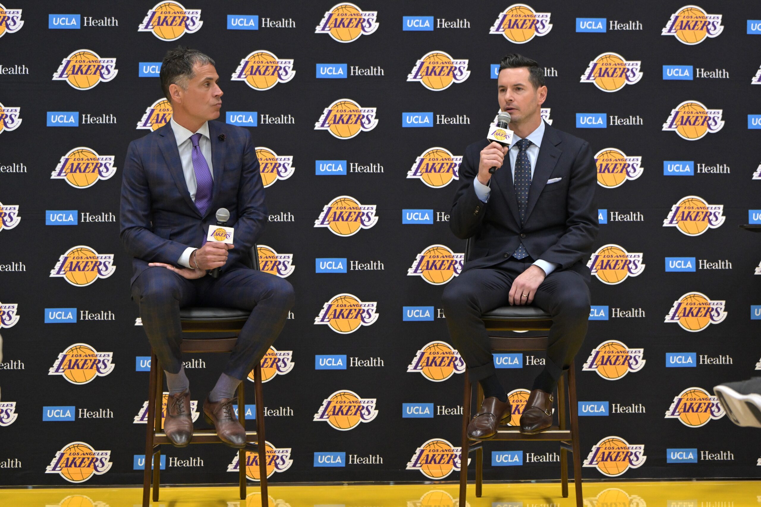 Los Angeles Lakers general manager Rob Pelinka loosk on as head coach JJ Redick speaks to the media during an introductory news conference at the UCLA Health Training Center.