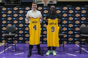 Jul 2, 2024; El Segundo, CA, USA; From left: Los Angeles Lakers first round draft pick Dalton Knecht (4) and second round draft pick Bronny James (9) pose at a press conference at the UCLA Health Training Center. Mandatory Credit: Kirby Lee-USA TODAY Sports