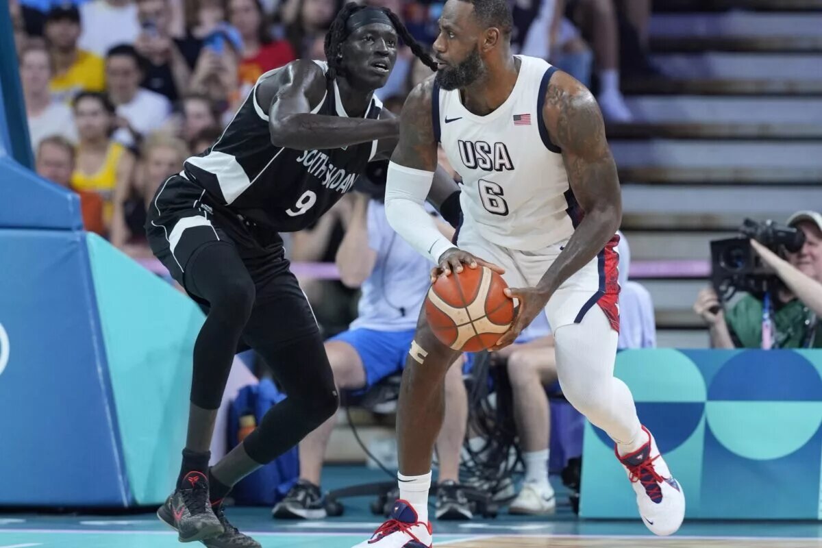 Jul 31, 2024; Villeneuve-d'Ascq, France; United States guard Lebron James (6) dribbles against South Sudan power forward Wenyen Gabriel (9) in the second quarter during the Paris 2024 Olympic Summer Games at Stade Pierre-Mauroy. Mandatory Credit: John David Mercer-USA TODAY Sports
