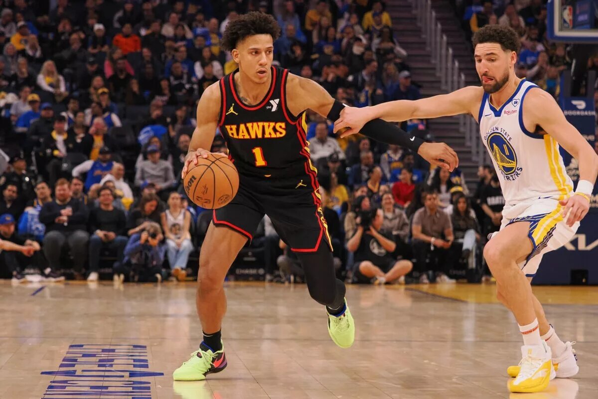 Atlanta Hawks forward Jalen Johnson takes Golden State Warriors player off the dribble