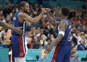 Kevin Durant and Anthony Edwards celebrate a play as Team USA teammates (Paris Olympics)