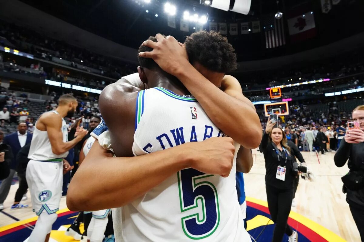 Minnesota Timberwolves center Karl-Anthony Towns (32) and guard Anthony Edwards (5) celebrate