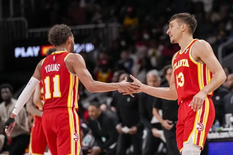 Atlanta Hawks guard Trae Young (11) and guard Bogdan Bogdanovic (13)