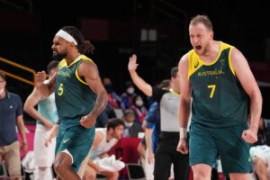 Aug 7, 2021; Saitama, Japan; Team Australia point guard Patty Mills (5) and Team Australia small forward Joe Ingles (7) react on the court against Slovenia in the second half during the Tokyo 2020 Olympic Summer Games at Saitama Super Arena. Mandatory Credit: Kyle Terada-USA TODAY Sports