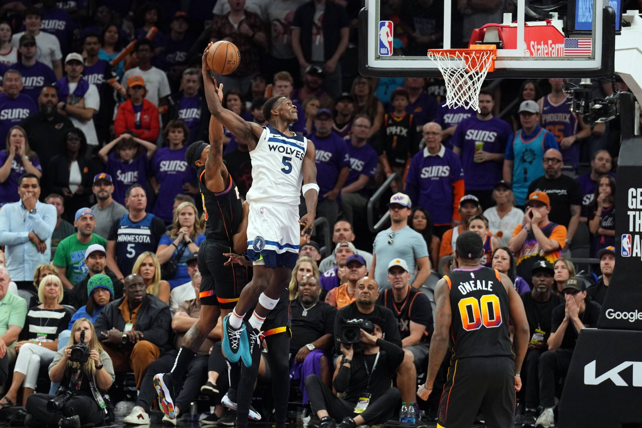 Apr 28, 2024; Phoenix, Arizona, USA; Minnesota Timberwolves guard Anthony Edwards (5) dunks against the Phoenix Suns during the second half of game four of the first round for the 2024 NBA playoffs at Footprint Center. Mandatory Credit: Joe Camporeale-USA TODAY Sports