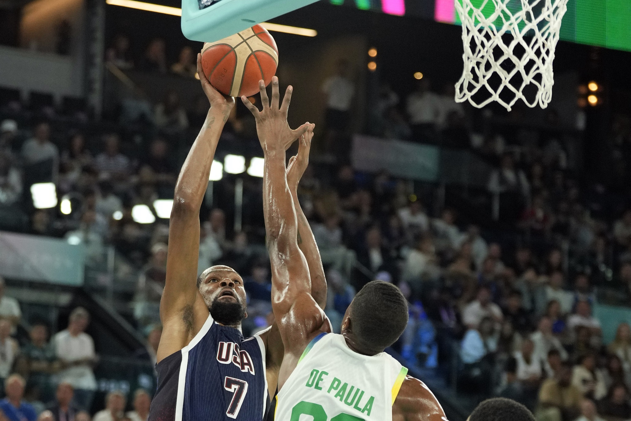 Aug 6, 2024; Paris, France; United States guard Kevin Durant (7) shoots against Brazil guard Georginho de Paula (32) in the first half in a men’s basketball quarterfinal game during the Paris 2024 Olympic Summer Games at Accor Arena. Mandatory Credit: Kyle Terada-USA TODAY Sports