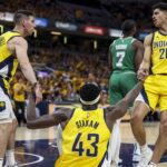 Indiana Pacers guard Ben Sheppard (26) and Indiana Pacers guard T.J. McConnell (9) help Indiana Pacers forward Pascal Siakam (43) stand up