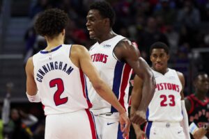 Detroit Pistons center Jalen Duren (0) and guard Cade Cunningham (2) celebrate