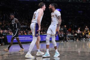 Los Angeles Lakers guard Austin Reaves (15) and guard D'Angelo Russell (1)