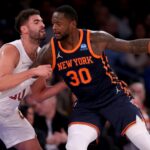 New York Knicks forward Julius Randle (30) backs down Cleveland Cavaliers forward Georges Niang (20)