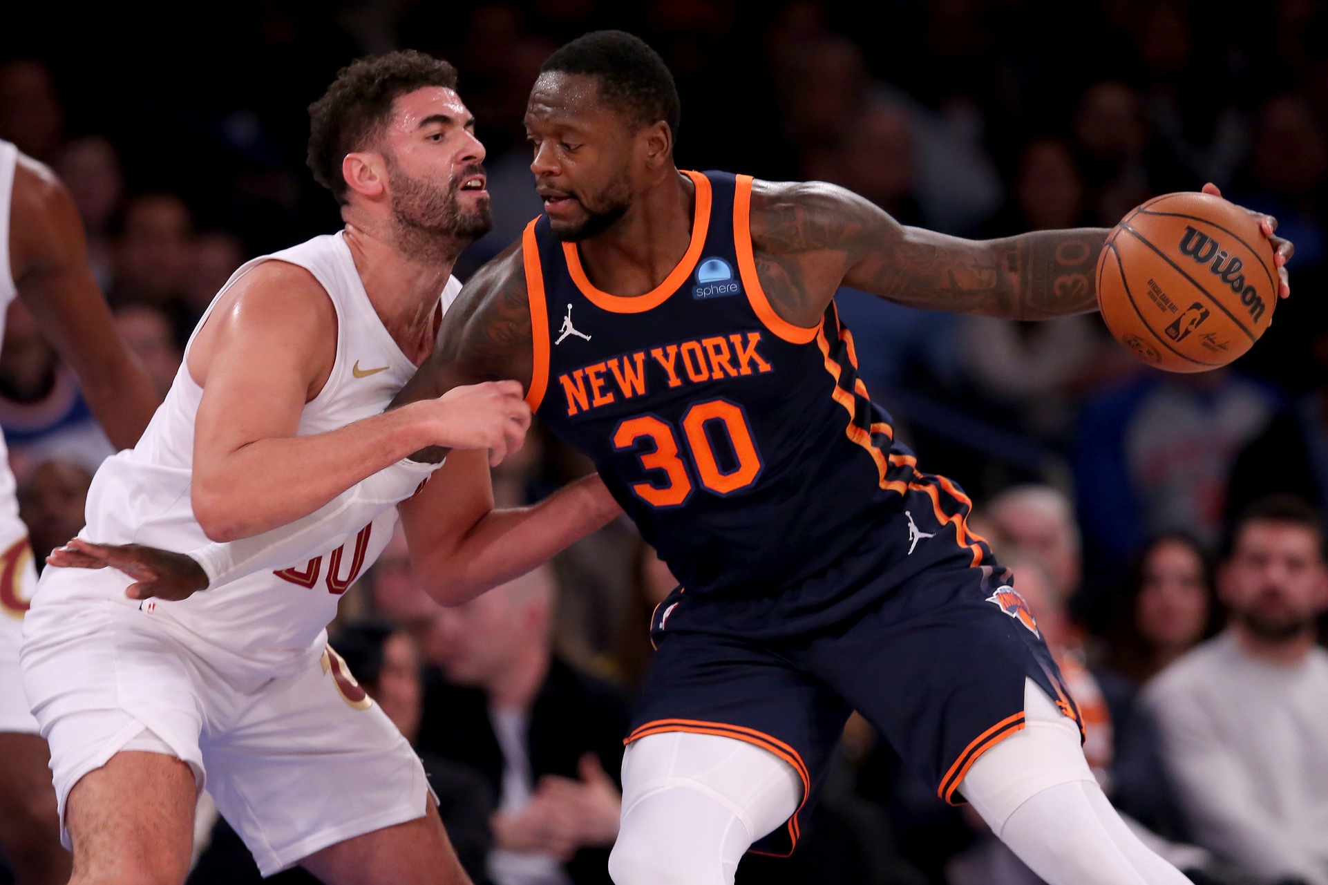 New York Knicks forward Julius Randle (30) backs down Cleveland Cavaliers forward Georges Niang (20)