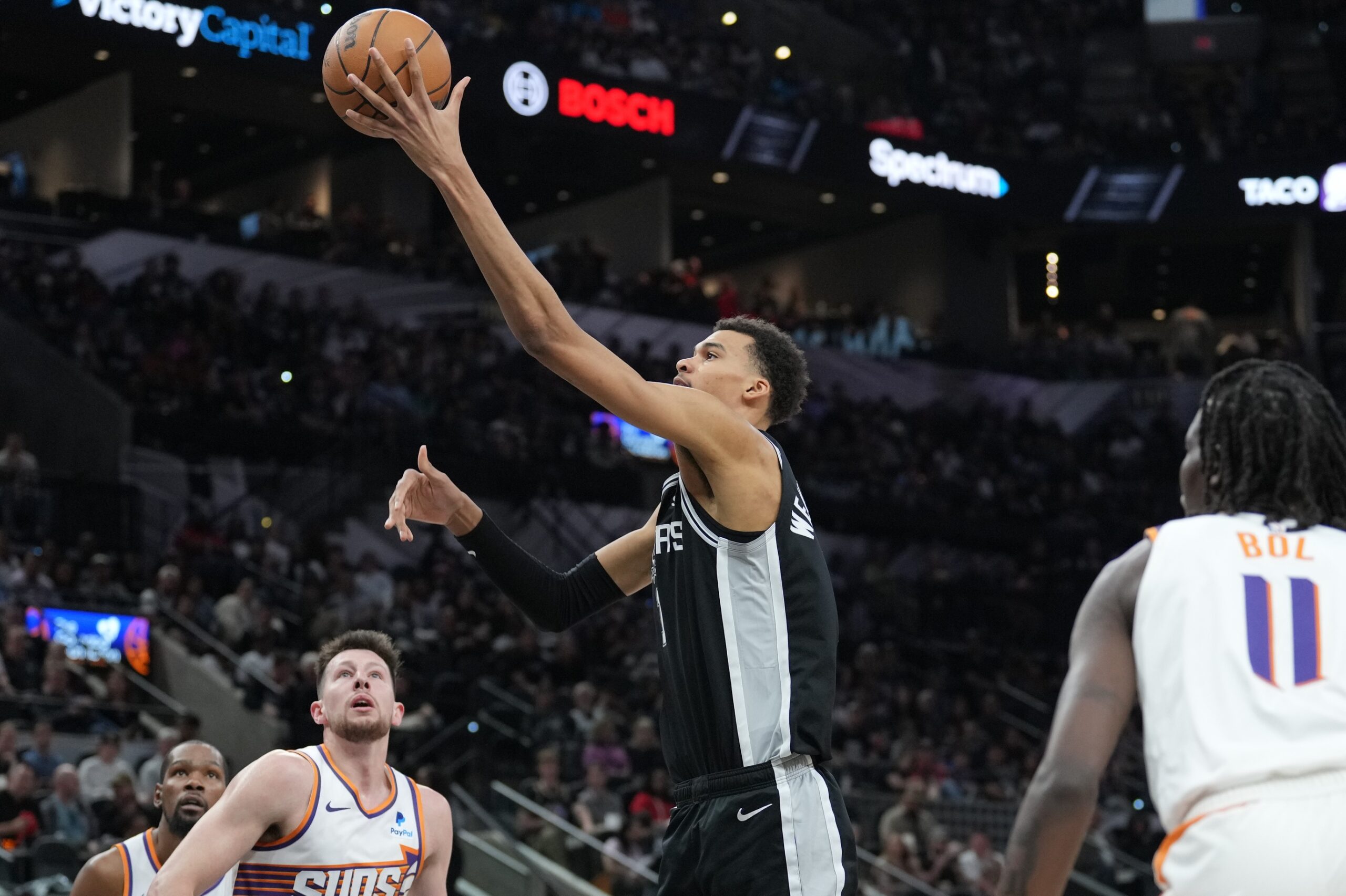 San Antonio Spurs center Victor Wembanyama shoots as Phoenix Suns center Bol Bol is unable to contest